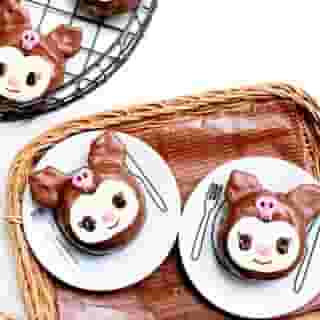 Get ready to cause havoc in the kitchen on #WorldChocolateDay! Visit the link in bio for the step-by-step recipe for these fun #Kuromi chocolate covered donuts on Sweet Happy News 🍩