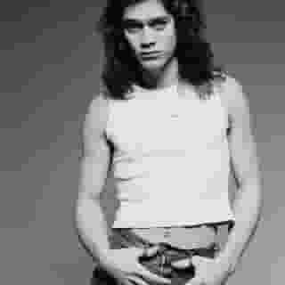 Today is the second anniversary of Eddie Van Halen's passing. Click the link in bio to read our definitive cover story on his life, music, and struggles. 📸 Fin Costello/Redferns/Getty Images, Randy Holmes/Disney General Entertainment Content via Getty Images