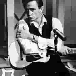 Johnny Cash, born on this day in 1932, is arguably country music’s most cited influence by younger artists, but Cash wasn’t above being influenced himself. He was forever a student of music, always listening for songs that moved him, be they country or otherwise. Cash would even record his own versions of the songs, from the country-rock of the Stones‘ “No Expectations” to the poignant coda of Nine Inch Nails‘ “Hurt.”⁠
⁠
Tap the link in bio for the Man in Black’s 11 coolest covers.⁠
⁠
Photo: Hulton Archive/Getty Images