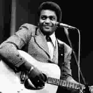 Charley Pride, the pioneering black country singer known for such hits as “Kiss an Angel Good Mornin'” and “Is Anybody Goin’ to San Antone,” has died from complications related to Covid-19, according to his publicist. He was 86. Learn more at the link in our bio. Photograph by Michael Putland/Getty Images