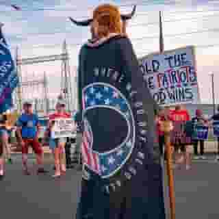 Believers of the QAnon conspiracy theory have been desperate for their anonymous leader to offer guidance after the election. Diehards still cling to the prospect of a Trump victory, even as Q makes an underwhelming return— but what's going to happen? Learn more at the link in our bio. Photograph by Olivier Touron/AFP/Getty Images