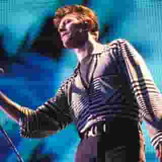 Today's #RSFlashback is David Bowie playing his 'Scary Monsters' track "Teenage Wildlife" live in 1995. The Birmingham, England show where he performed the song is the exact show where 'Ouvrez Le Chien' (the newest archival Bowie live album to hit streaming services) bonus tracks “Moonage Daydream” and “Under Pressure” were recorded. Tap the link in our bio to see his performance. Photograph by Mick Hutson/Redferns/Getty Images