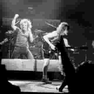 AC/DC's 'Back in Black' turns 40 today. At the link in our bio, we look back at 25 essential songs from the Aussie hard-rock legends. Photograph by by Michael Putland/Getty Images