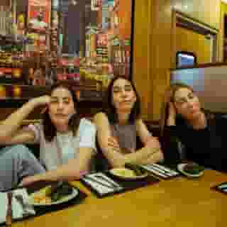 Haim have embarked on a five-date Deli Tour this week, performing at delicatessens across the country for a lucky handful of fans, family and friends. Swipe through to see photos from their New York stop and click the link in our bio to see them cover Britney Spears. Photographs by @nicolemago