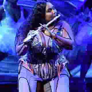 @lizzobeeating opened the 2020 #Grammys by belting out "Cuz I Love You" and remixing "Truth Hurts" with an orchestra and ballerinas. Link in bio for more. Photograph by Rob Latour/Shutterstock