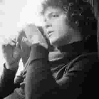 Lou Reed died six years ago today. Click the link in our bio for a throwback performance of the singer playing a fiery "Coney Island Baby" in 1984. Photograph by Michael Putland/Getty Images