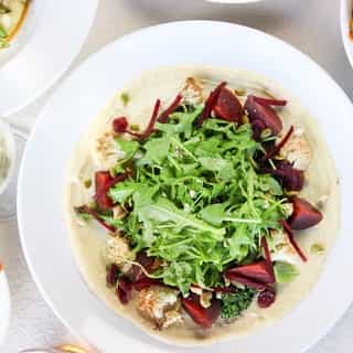 ROASTED VEGETABLE SALAD • local beets, cauliflower and broccolini, vegan cashew cream, arugula, pumpkin seeds, dried cranberries, and cashews.⁠
⁠
See what our Culinary Development Chef, Josh Gale, has to say about this vegan-friendly dish ⬇️. ⁠
⁠
"We’re serious about making plant-based food exciting and serving the best of BC’s bounty. This dish features local roasted beets, charred cauliflower and broccolini, tossed in a herb dressing and placed on top of a rich, dreamy cashew cream. ⁠
⁠
This is definitely not your average vegan salad.”⁠
⁠
Try it with our Head Sommelier's pairings: ⁠
1️⃣ @redtruckbeer Truck Road Trip Classic Lager | Vancouver⁠
2️⃣ @BartierBros Rosé | Oliver⁠
⁠
Visit the link in our bio to view the full menu and hurry in before the Fall Fresh Sheet ends.