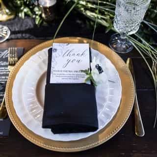 The bold, black base color combined with the gold and white plates and utensils makes for a fabulous table set. 💫

What do you think of these black essential linen napkins with the black crushed velvet runner? Do you love the bold as much as we do?🥂🤍

If you want to see more linens and coverings, click the link in our bio!

Photography: @jeramie_lu_photography
Speciality rentals: @mountainvibesrentals
Catering: @cherribc
Cake: @deliciousdesignsreno
Linens: @creativecoverings