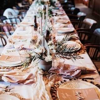⁠This table is all dressed up and ready to bring the boho glam to your big day! To recreate this look use our Ivory Velo table runners and dusty rose plush velvet napkins, and don't forget all those beautiful florals and chargers! ⁠
⁠
Wedding season is coming up fast. Give us a call to plan your dream table setting today!⁠
⁠
⁠
Ceremony & Reception Set Up: @thehytch⁠
Flowers: @galenaforestflowers⁠
Goblets: @renotahoevintagerentals⁠
Videography: @4joymedia⁠
Photography: @dianachristinephotography⁠