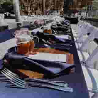 Add a touch of class into your tabletops with our storm navy lamour table coverings + napkins. 🌲 Paired here with wooded details for this wedding at Round Hill Pines Beach in Lake Tahoe, we think it's #mountainwedding perfection. 🐻📸⁠
⁠
💍 Photo by: @rhpb_weddingsandevents