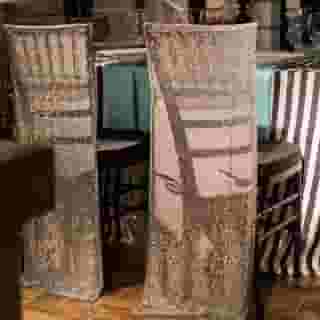 Glam up with a Chair Cape! Our Chair Capes easily fit atop a Chiavari Chair just like our Chair Caps, but drape down the back to the floor to really create a unique look of luxury.⁠
⁠
Chiavair Chair Cape l Silver Sequin