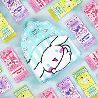 Enjoy some sweet treats on the go! 🍫💞 This adorable Cinnamoroll @loungefly backpack and Hello Kitty & Friends Chocolate Bars are available exclusively at @officialfye. Link in bio! 